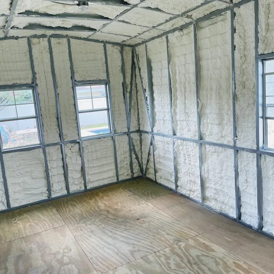 Closed-cell spray foam insulation applied to wall cavities in a residential project in Fate